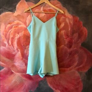 Bebe turquoise romper with bow in back